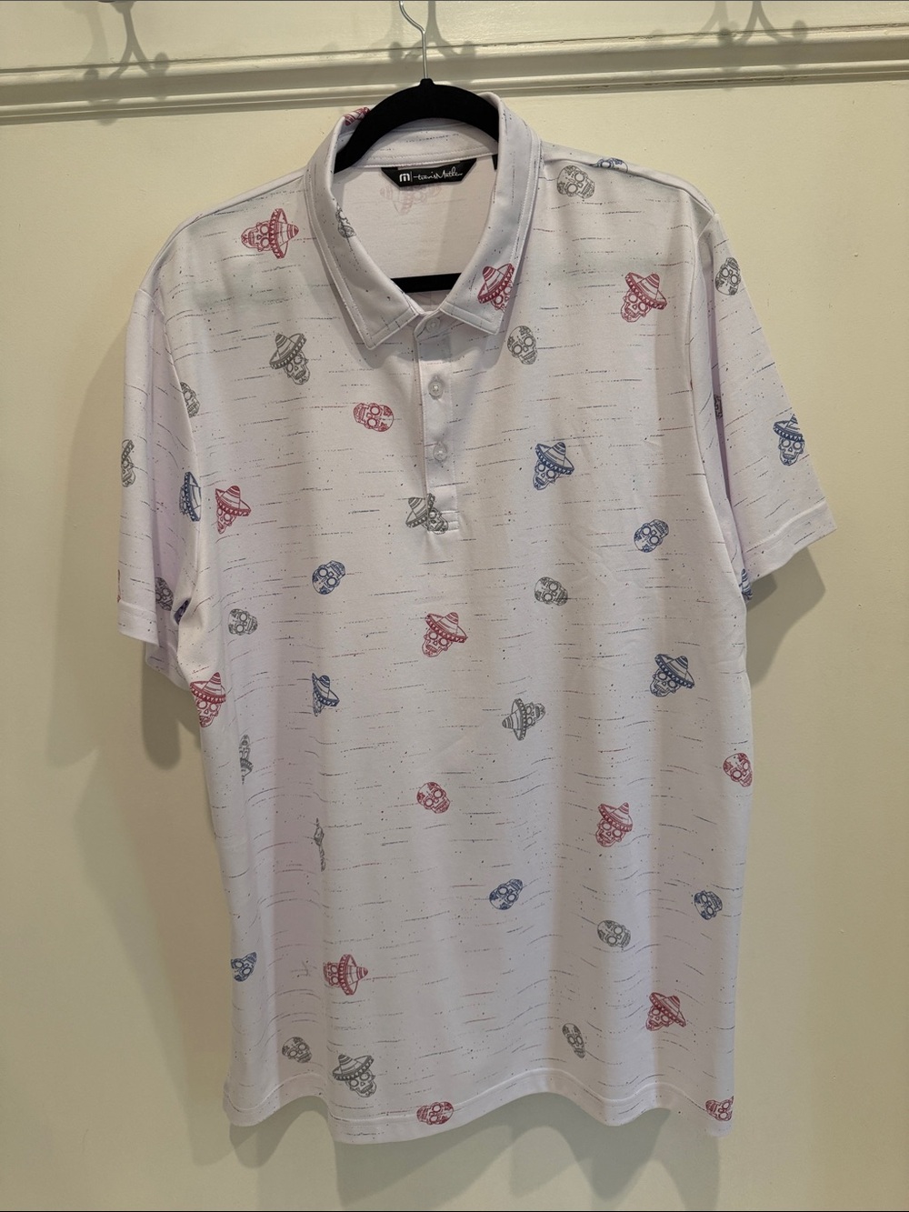 Travis Mathew White Polo with Red, Blue, and Gray Space Print